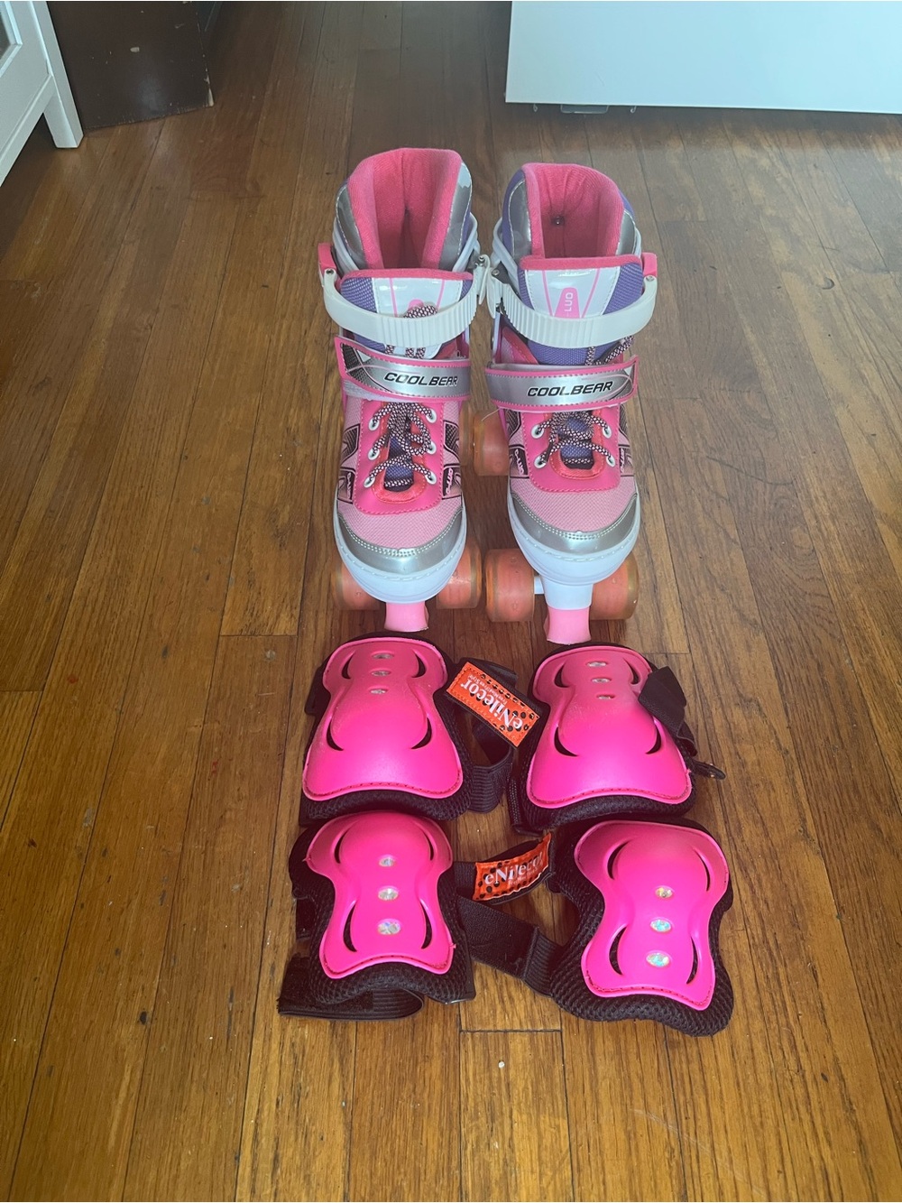 Pink Girls Adjustable Roller Skates with Pink Protective Pads Size M